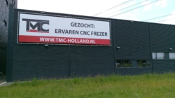 TMC spandoek